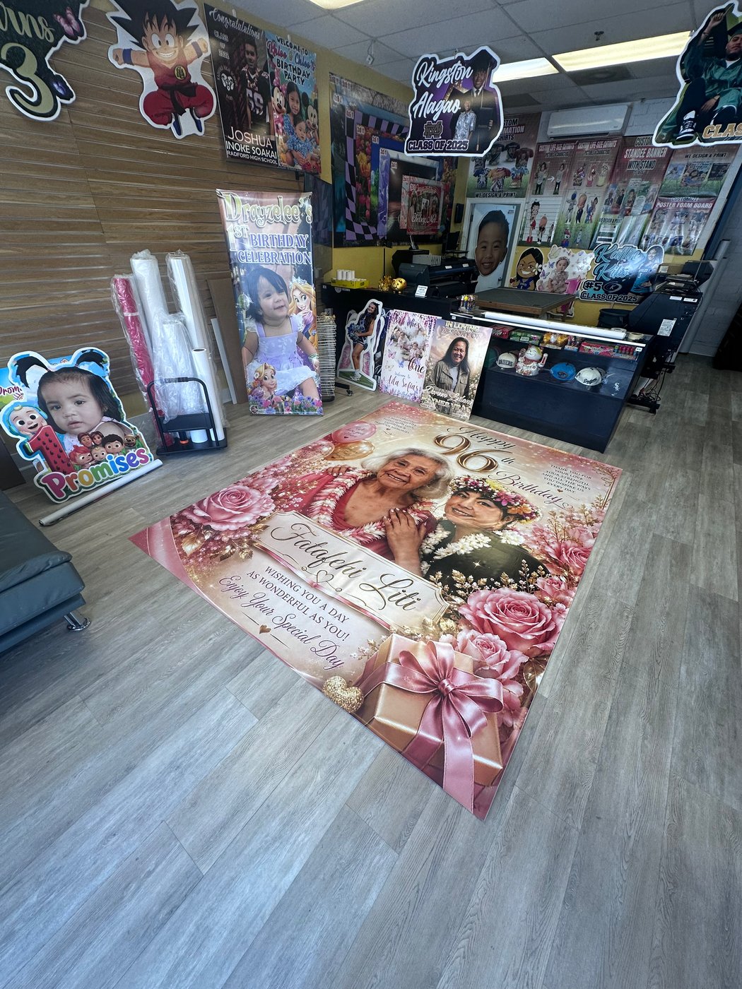 Custom 10x8 ft floral banner printed for a 90th birthday celebration at Graphic Project 808