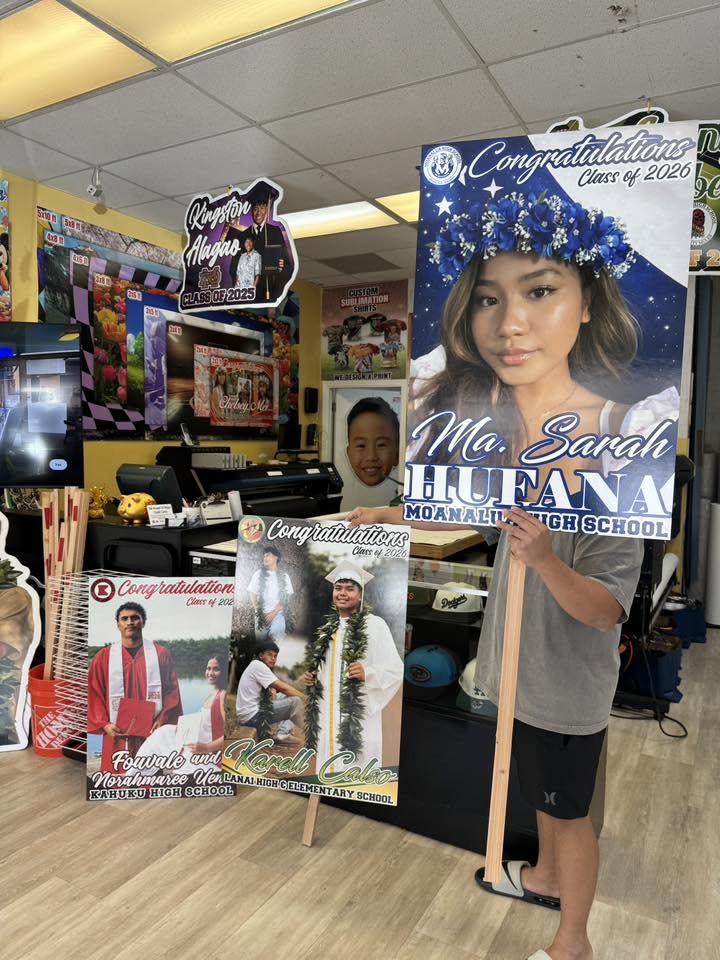 Custom graduation standee banners printed and displayed at Graphic Project 808